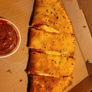 Pepperoni, chicken and cheese calzone