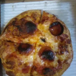 1st Pepproni pizza with burned inedible topping.