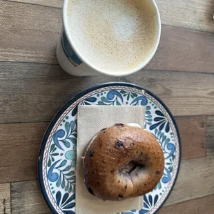 Hazelnut latte made with oat milk and a berry bagel with fruit and cream cheese