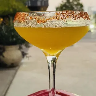 a cocktail in a coupe glass