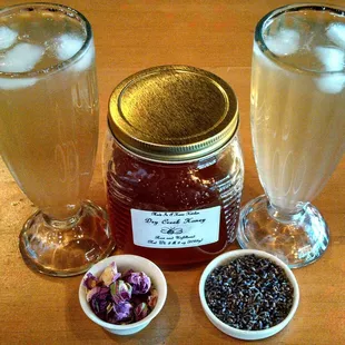 We infuse local raw honey with rose petals or lavender buds for a unique flavored syrup boost! Try them in our Iced Teas!