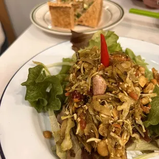 a plate of salad on a table