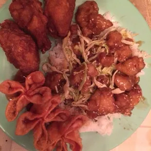 Sesame chicken, take out, less than half of the order pictured on the plate.