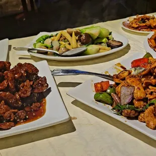 a table full of chinese food