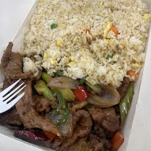 Mongolian beef 0ver fried rice.( with onion and bell pepper and red chilie peppers. I also ask them to add jalapeño. )