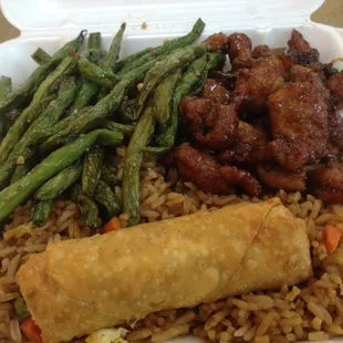 a takeout container with rice, meat, and veggies