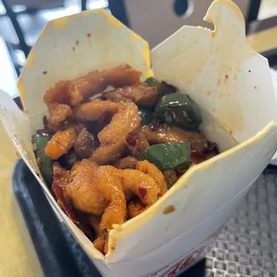 chinese food in a takeout container
