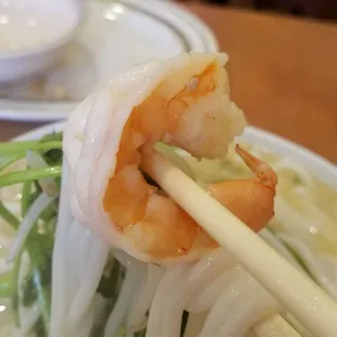 Shrimp and ingredients cooked in the super hot soup.