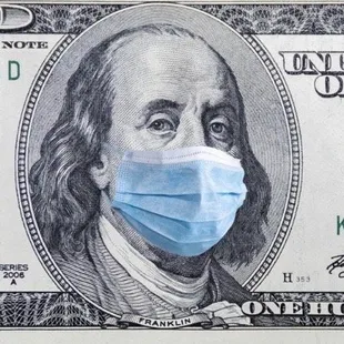 a hundred dollar bill with a face mask on it