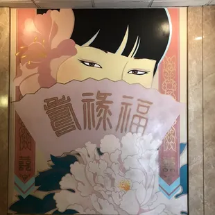 a woman holding a flower