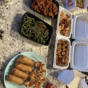 Egg rolls, crab puffs, salt and pepper tofu, shrimp and walnut green beans, chow mein general sao chicken white rice