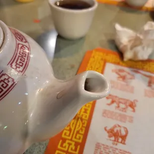 a teapot with a tea in it