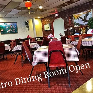dining room with red chairs and white checkered tablecloths