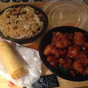 Pork fried rice (slightly salty) and Kung Pao chicken with one of two veggie rolls.