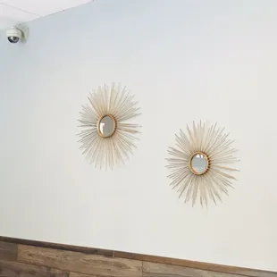 two sunbursts on the wall