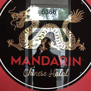 a man standing in front of a window