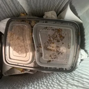 two plastic containers with food in them