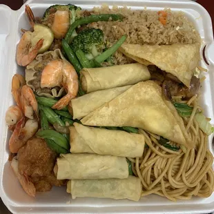 Fried rice, chow mein, beef broccoli, orange chicken, string beans, baby octopus, vegetable egg rolls, crab wontons, and lemon shrimp.