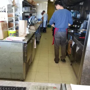 The kitchen staff preparing your meal