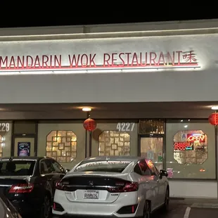 cars parked in front of the restaurant