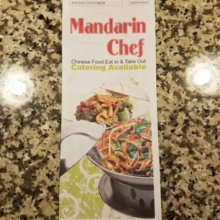 a cookbook on a granite countertop