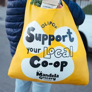 a woman carrying a shopping bag