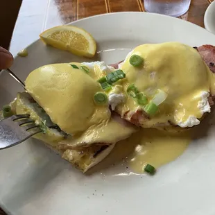 a plate of food with eggs benedict
