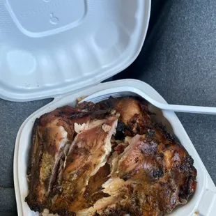a piece of meat in a styrofoam container