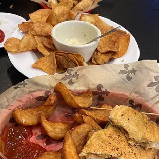 Pesto shrimp panini with fries, queso and homemade chips, overstuffed fried shrimp poboy with fries