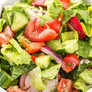 a salad in a white bowl