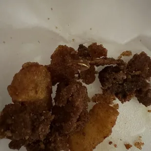 Burnt portions of food.