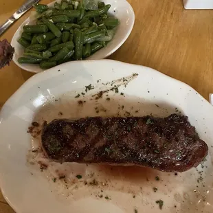 NY Strip cooked med rare with a side of green beans