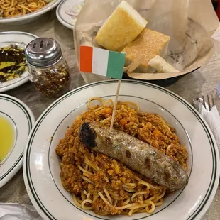 a plate of spaghetti and sausage