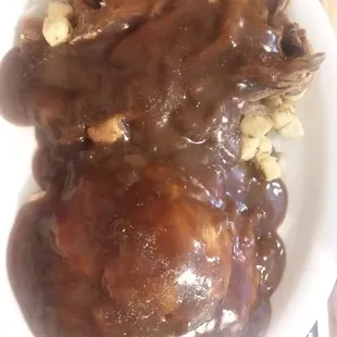 The roast beef smothered in gravy still tasted bland the stuffing underneath was just bread crumbs with no seasoning.