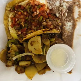 Huevos Rancheros with home fries and beans
