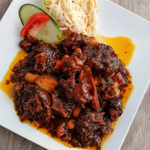 a plate of meat and vegetables