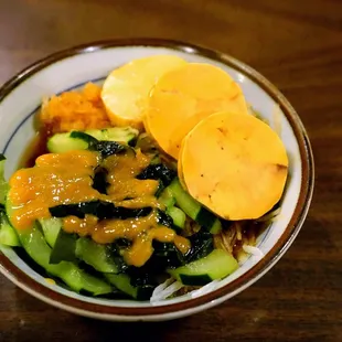 Ankimo: steamed and chilled monk fish liver sliced sashimi style over a bed of shredded daikon radish dressed with ponzu sauce ($12).