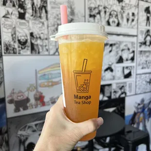 Passion fruit green tea with passion fruit popping boba