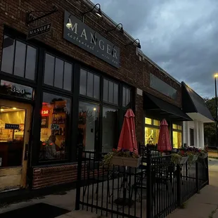 Entrance and front seating area at twilight.