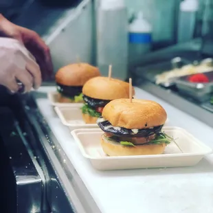 Portobello mushroom burger (V) grilled portobello, wild arugula, mozzarella, grilled tomato, house pesto on focaccia