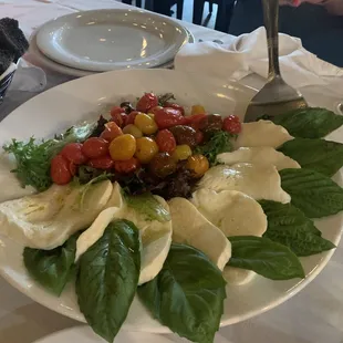 Caprese salad with homemade fresh mozzarella and fire roasted tomatoes.