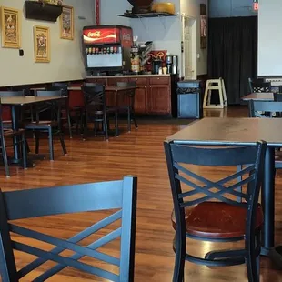 Seating area. Self serve soda machine.