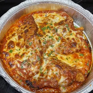 Chicken Parmesan, loaded with sauce and cheese