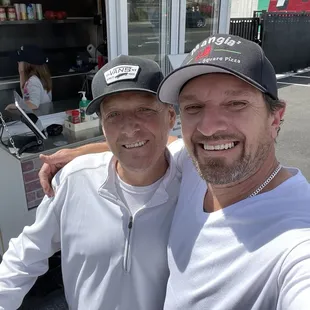 two men posing for a selfie