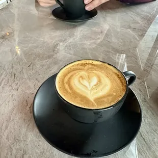Marzipan latte ($6.5) &amp; black truffle cappuccino in back ($6) - both vegan and both phenomenal!