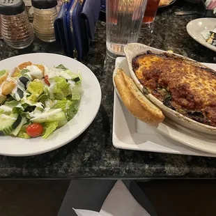 two plates of food and a glass of water