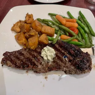 New York strip steak with sweet potatoes.