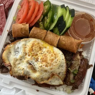 Chicken and Pork Rice Bowl combo with extras: fried egg (+2) and pork/shrimp eggroll (+2.50)