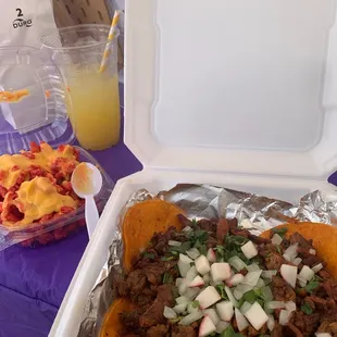 Mini Tacos, agua de piña, hot Cheetos with cheese