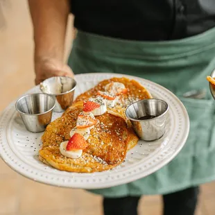 oat +brown rice pancakes  with chi and hemp seeds, topped with house made berry compote and organic maple syrup